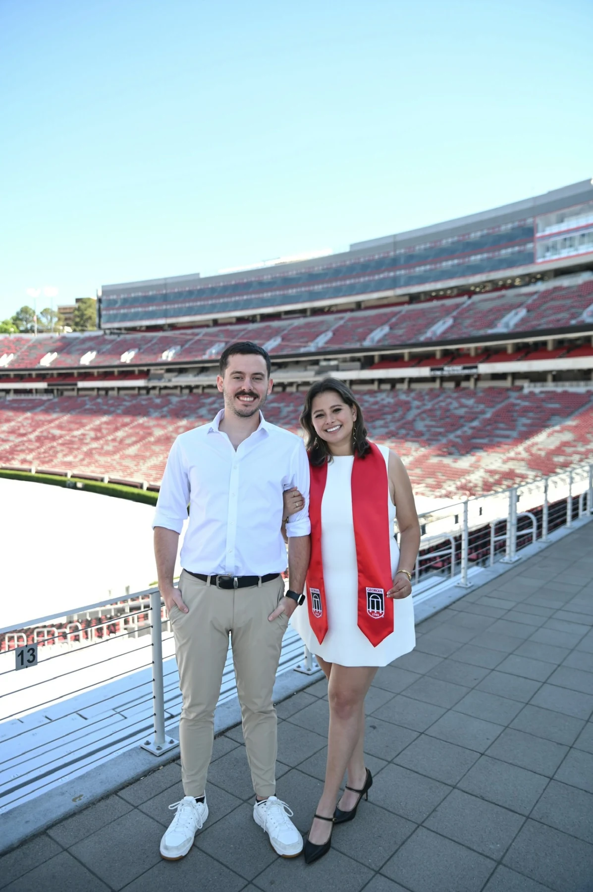 Anna Medina celebrating graduation at Sanford Stadium